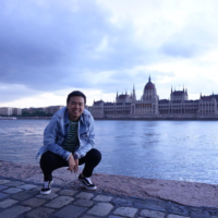 Michael in Budapest, Hungary, with the Hungarian Parliament Building in the background